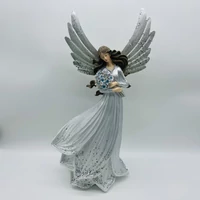 Álló angyal virágcsokorral (49 cm x 28 cm x 17 cm)