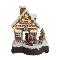 Játszó és mozgó mézeskalács házikó LED-del (23 cm)