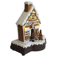 Játszó és mozgó mézeskalács házikó LED-del (23 cm)